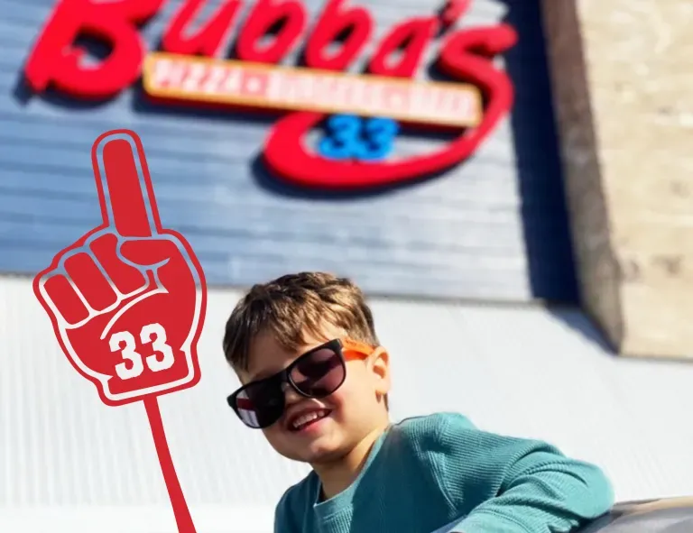 Child in front of a Bubba's location
